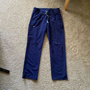 Navy Figs scrub pants with bleach stains